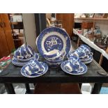 An 20 piece blue and white willow pattern tea set COLLECT ONLY