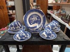 An 20 piece blue and white willow pattern tea set COLLECT ONLY