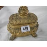 A 20th century gilded trinket box.