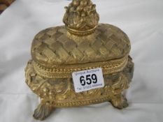 A 20th century gilded trinket box.