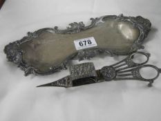 A Victorian plated candle snuffer on tray.