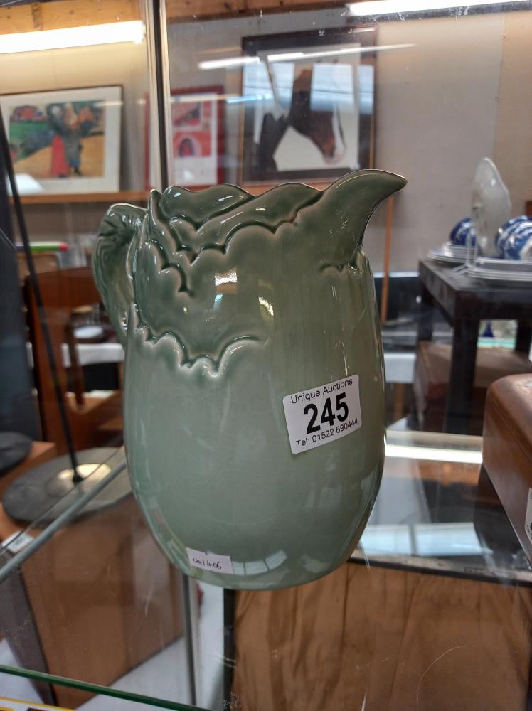 A green glazed Clarice Cliff jug