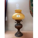 A vintage brass oil lamp