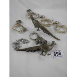 A mixed lot of silver plate including napkin holder, pig etc.,