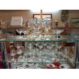 A good lot of drinking glasses on 2 shelves COLLECT ONLY