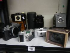 A mixed lot of camera's, telescopic lens, viewer etc.,