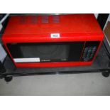 A Cookworks red microwave oven, COLLECT ONLY.