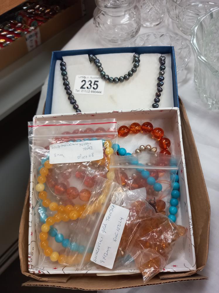 A set of beads and earrings, plus a quantity of other loose beads etc