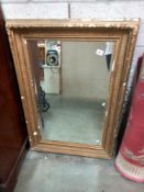 A large gilt framed bevel edged mirror. COLLECT ONLY