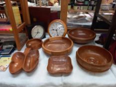 A good lot of wooden bowls and clocks
