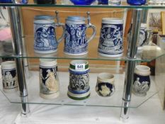 A selection of blue beer steins, COLLECT ONLY.