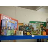 A quantity of jigsaw puzzles etc.,