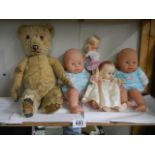 A quantity of vintage dolls and an old teddy bear, a/f.
