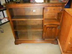 An oak glazed bookcase with side cupboard and drawer, COLLECT ONLY.