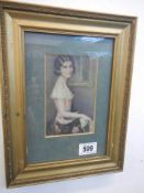 A small portrait print of a young lady in a gilt frame.