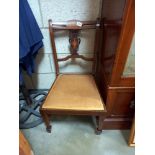 An Edwardian inlaid nursing chair