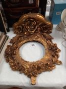 An ornate gilded circular mirror frame (no glass) COLLECT ONLY