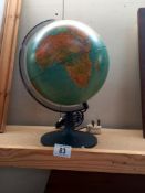 A 9" diameter globe with light, in working order COLLECT ONLY