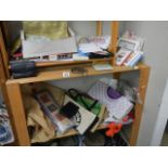 Two shelves of miscellaneous cards, bags etc.,