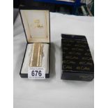 A boxed Colibri cigarette lighter (never used).