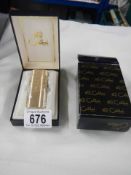 A boxed Colibri cigarette lighter (never used).