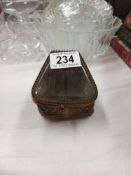 An early French embossed watch/jewellery box with glass top