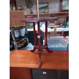 A dark wood stained triple pillared tripod wine table COLLECT ONLY