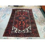A red rug with Middle Eastern patterns (approximately 156cm x 134cm) collect only