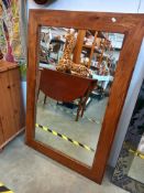 A large teak framed mirror Collect only
