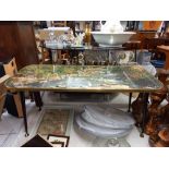 A vintage coffee table with rocky white water in the jungle Collect only