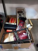 A box of vintage electrical items including Pifco trouser press and caddy-making tea dispenser