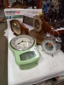 A quantity of clocks etc including an Enfield green metallic clock