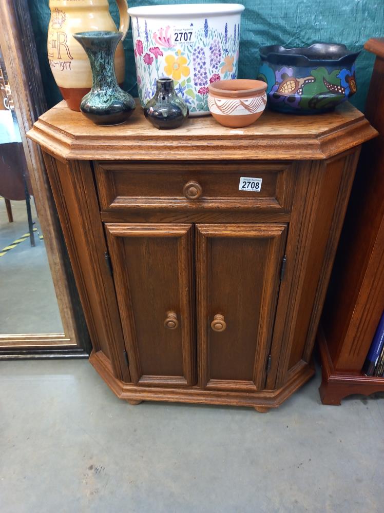 An oak veneered 2 door, 1 drawer cupboard COLLECT ONLY