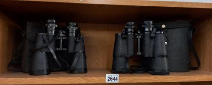 A pair of super zenith 20x50 Binoculars and a pair of Regent 10x50 binoculars. Collect Only