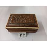 A carved wood box.