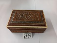 A carved wood box.