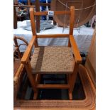 A vintage child's rocking chair with rope twist seat COLLECT ONLY
