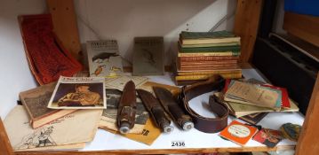 A quantity of vintage scouting books, Girl guide items, badges, belt and knives