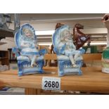 A pair of continental bisque seated figures Collect only