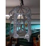 A wrought iron exterior porch lantern, (no glass) Collect only