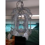 A wrought iron exterior porch lantern, (no glass) Collect only