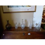 A quantity of interesting cut glass & etched glass , vintage decanters together with perfume