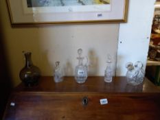 A quantity of interesting cut glass & etched glass , vintage decanters together with perfume