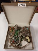 A quantity of costume jewellery including brooches etc