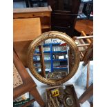 An oval gilt framed mirror COLLECT ONLY