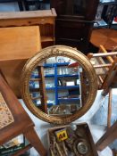 An oval gilt framed mirror COLLECT ONLY