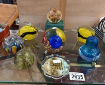 A quantity of glass paperweights. Collect Only