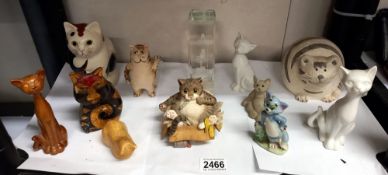 A collection of cat ornaments including Wade Tom & etched glass paperweight etc.