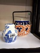 An octagon pottery Imari pattern biscuit barrel & a Coalport Blue Willow ginger jar COLLECT ONLY