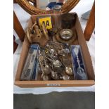 A tray of metalware including tourist spoons, brass cannon & AA badge etc.